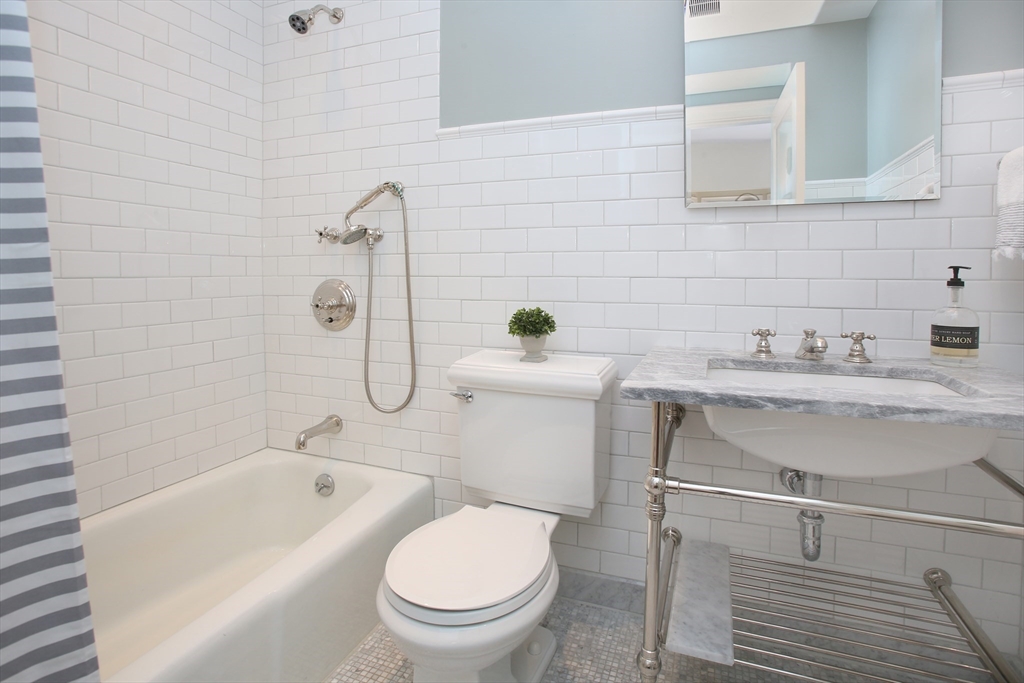 615 Massachusetts Avenue, Unit 2 Boston, MA 02118 - Photo 9 of 32 a bathroom with a sink toilet and shower