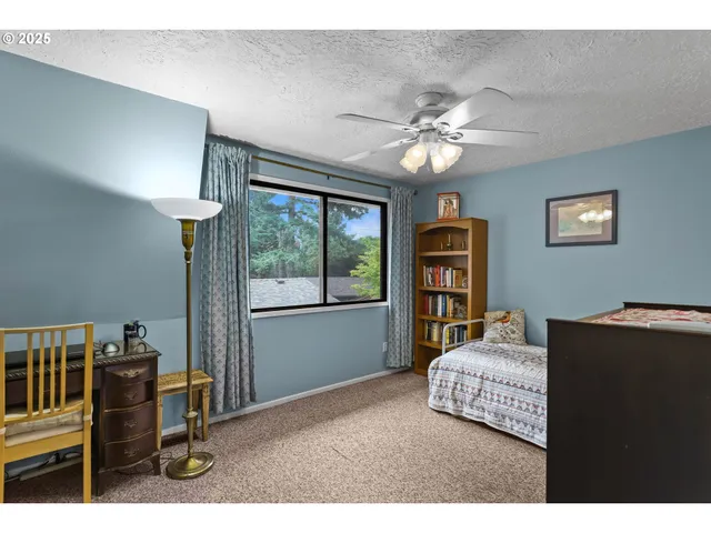 a bedroom with furniture and a chandelier