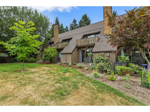 a aerial view of a house with a yard