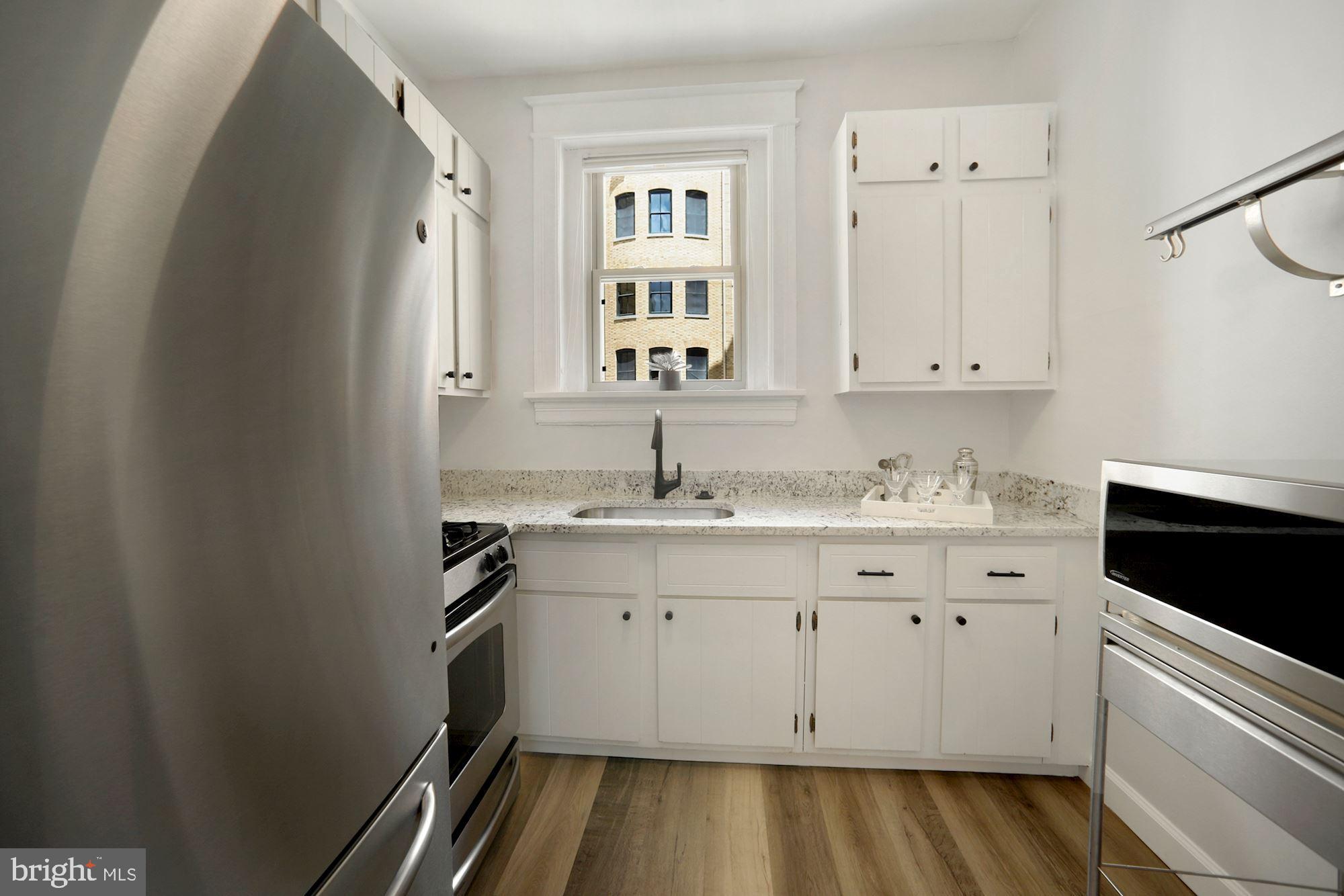 2010 Kalorama Road Northwest, Unit 406 Washington, DC 20009 - Photo 12 of 20 Abundant classic white cabinet storage