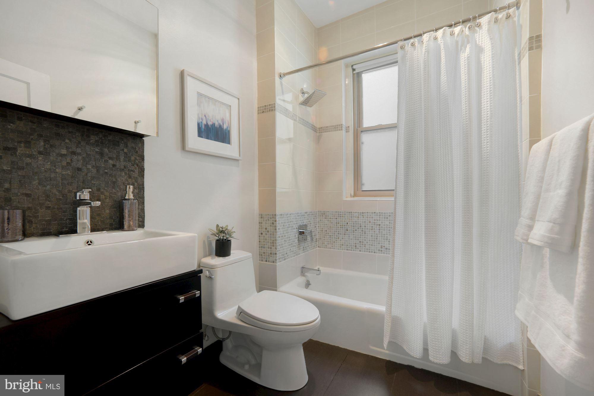 2010 Kalorama Road Northwest, Unit 406 Washington, DC 20009 - Photo 14 of 20 Updated modern bath w/a window