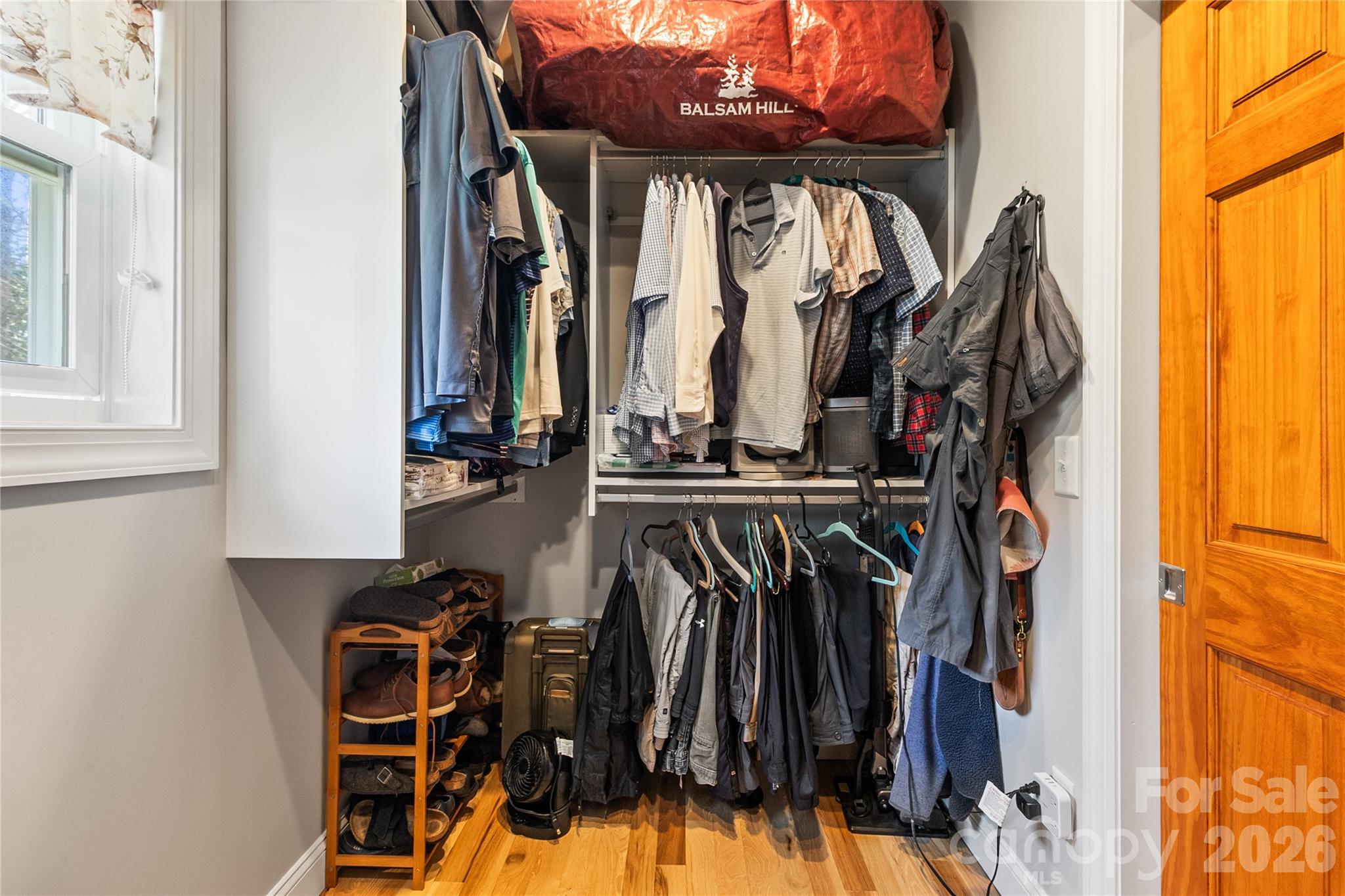 1103 River Ridge Way Lenoir, NC 28645 - Photo 21 of 46 a view of walk in closet with clothes and shoes