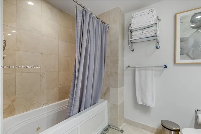 a bathroom with a shower and a toilet
