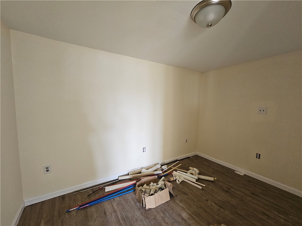 949 Stone Street Corpus Christi, TX 78418 - Photo 11 of 13 a room with a wooden floor and a sink