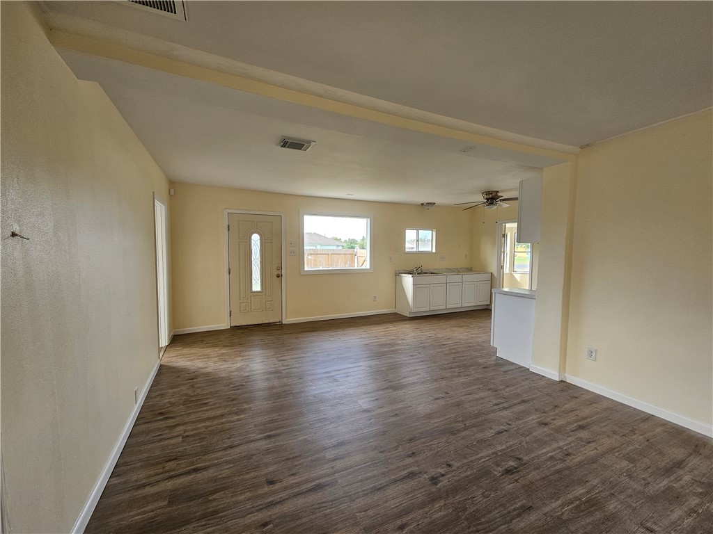 949 Stone Street Corpus Christi, TX 78418 - Photo 12 of 13 a view of empty room with window and wooden floor