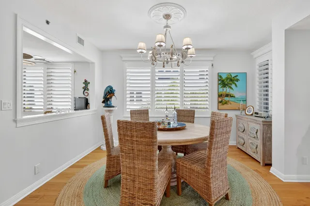 a view of a dining room with furniture and window