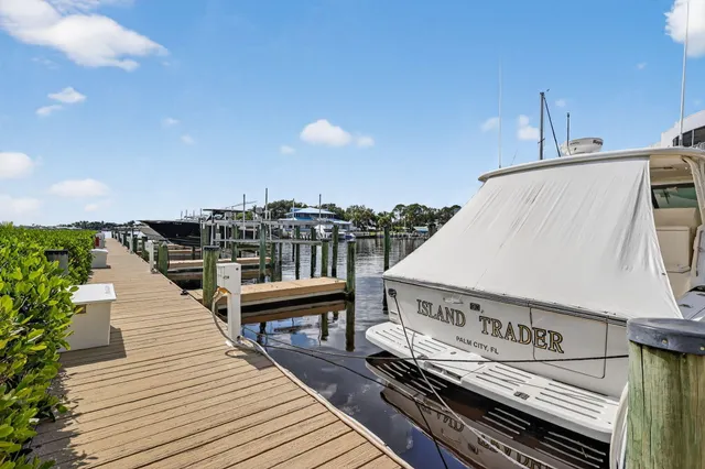a view of a balcony with wooden benches