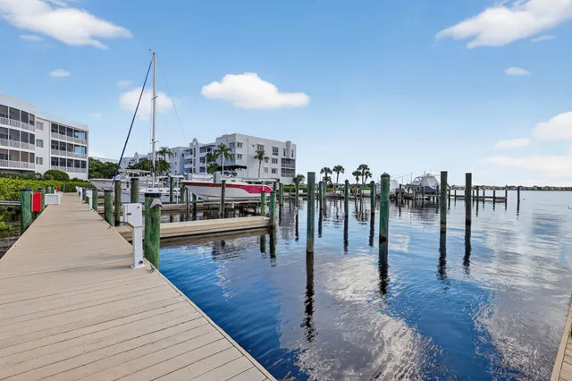 a view of a patio with dining table and chairs