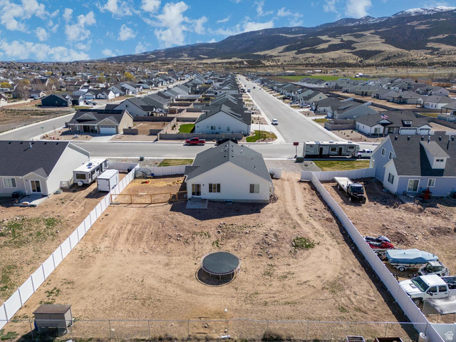 4349 Half Mile Road East Enoch, UT 84721 - Photo 33 of 36 Aerial view of residential area with a mountainous background