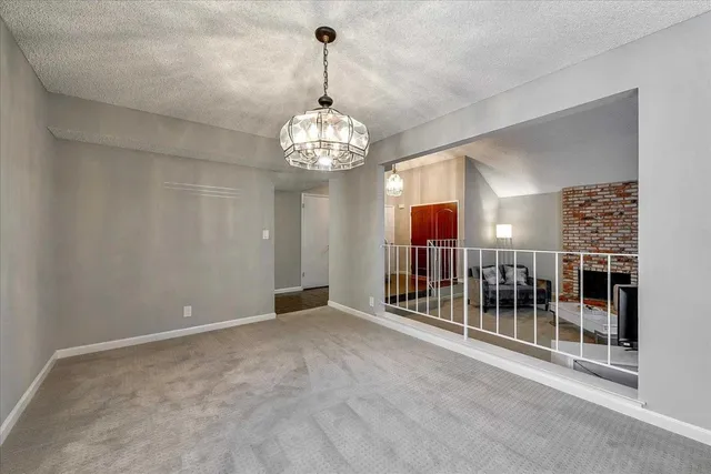 a view of a big room with windows