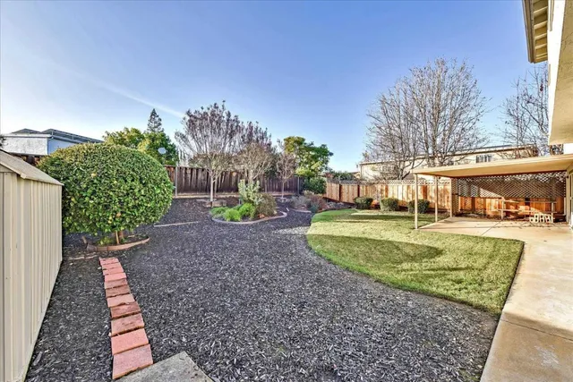 a view of house with yard