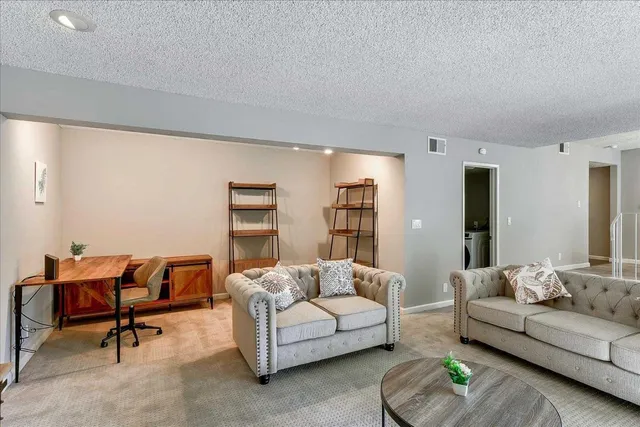 a living room with furniture and a couch