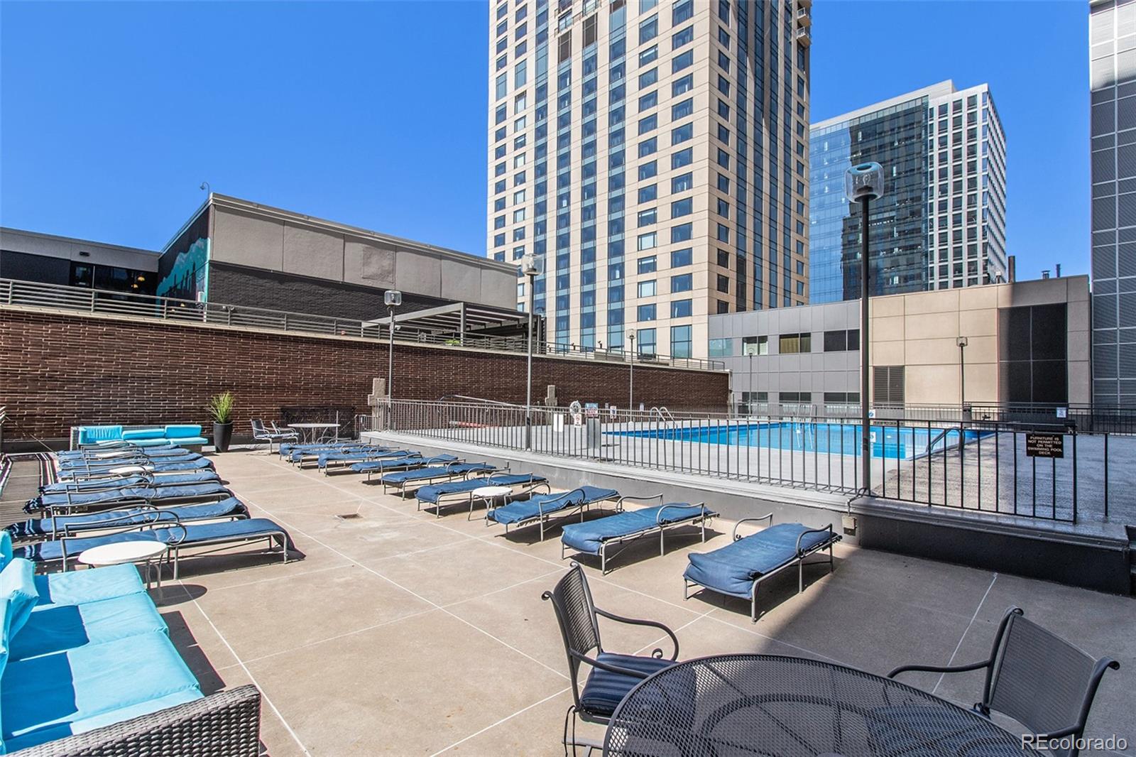 1020 15th Street, Unit 25B Denver, CO 80202 - Photo 23 of 33 a view of a patio with a table and chairs