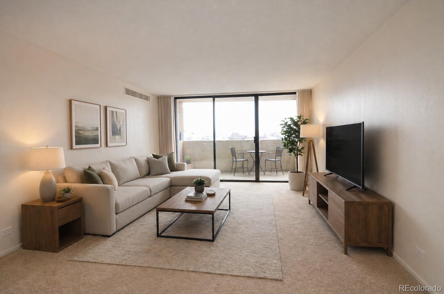 1020 15th Street, Unit 25B Denver, CO 80202 - Photo 3 of 33 a living room with furniture and a flat screen tv