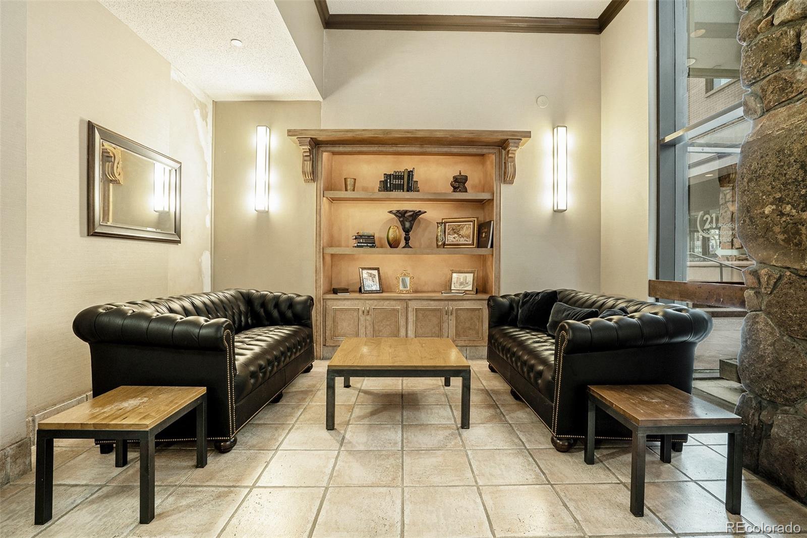 1020 15th Street, Unit 25B Denver, CO 80202 - Photo 32 of 33 a living room with furniture and a piano