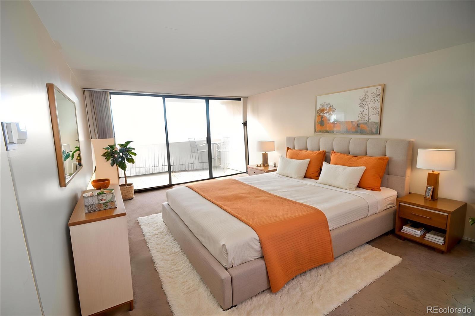 1020 15th Street, Unit 25B Denver, CO 80202 - Photo 5 of 33 a bedroom with a bed and wooden floor