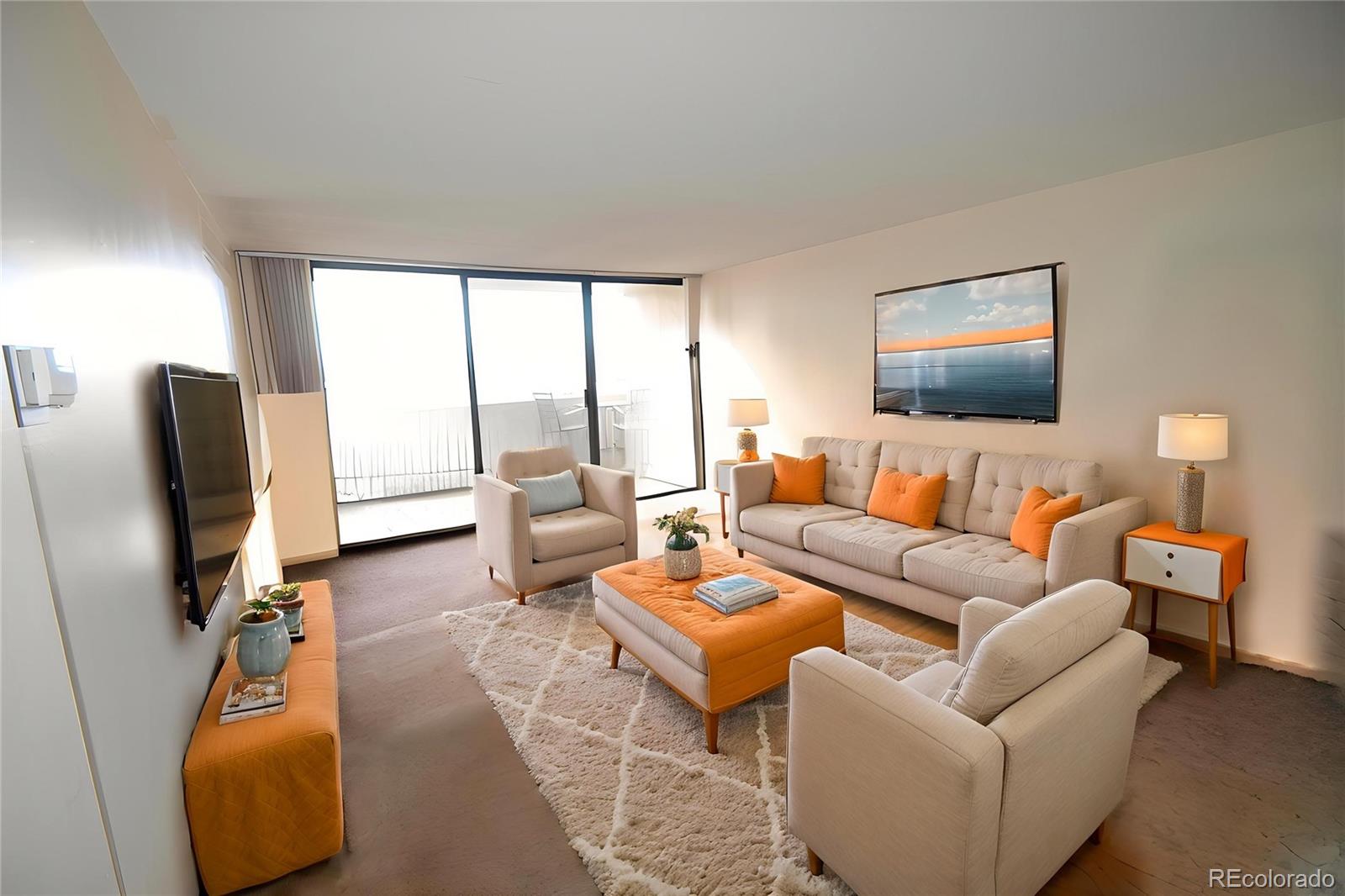 1020 15th Street, Unit 25B Denver, CO 80202 - Photo 6 of 33 a living room with furniture and a flat screen tv