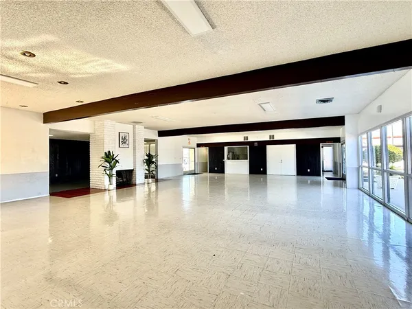 a lobby with furniture and window