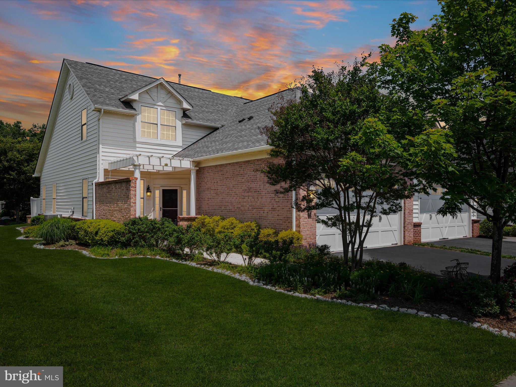 44322 Stableford Square Ashburn, VA 20147 - Photo 1 of 63 a front view of a house with a garden and yard