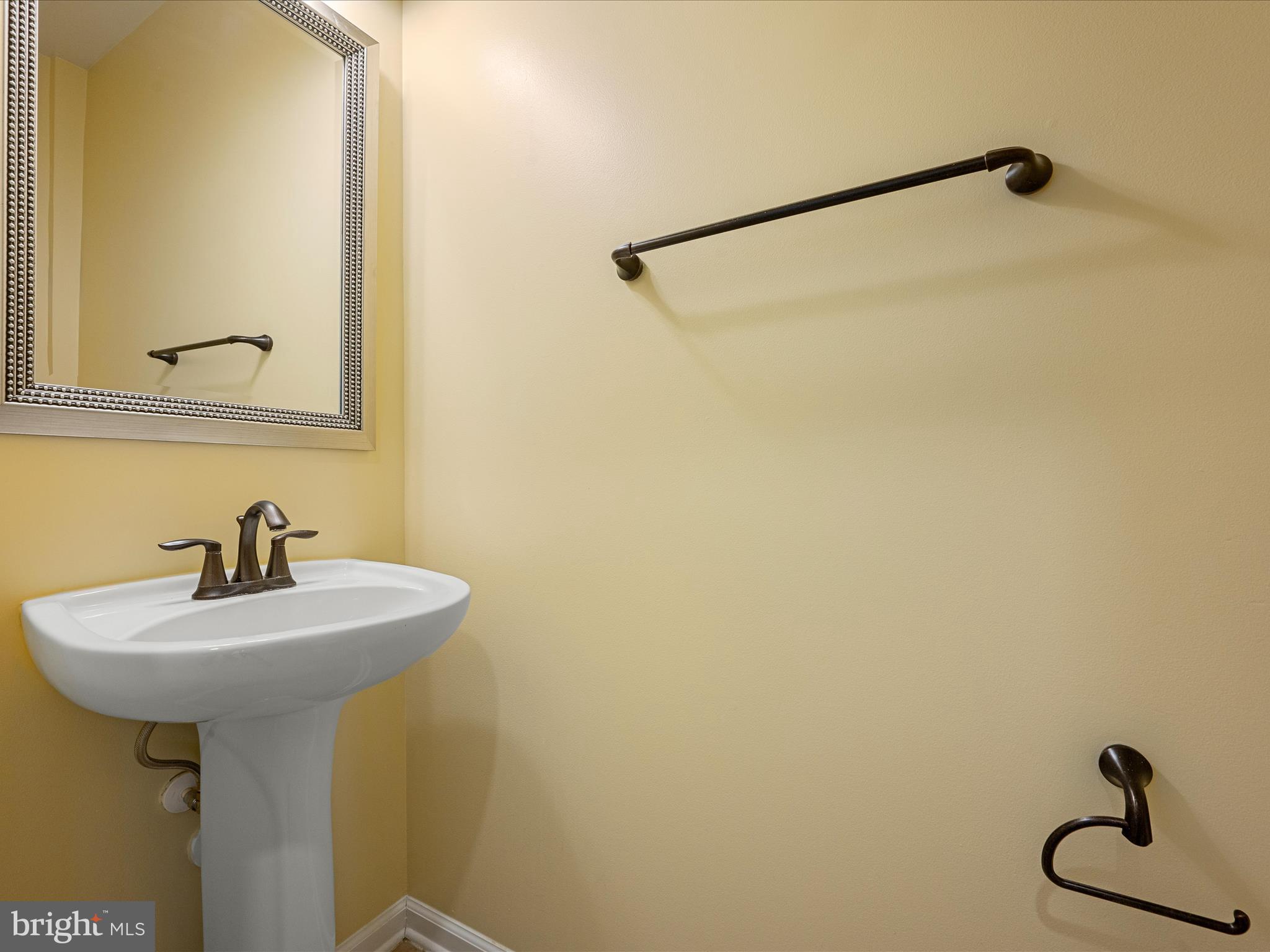 44322 Stableford Square Ashburn, VA 20147 - Photo 21 of 63 a bathroom with a sink and a mirror