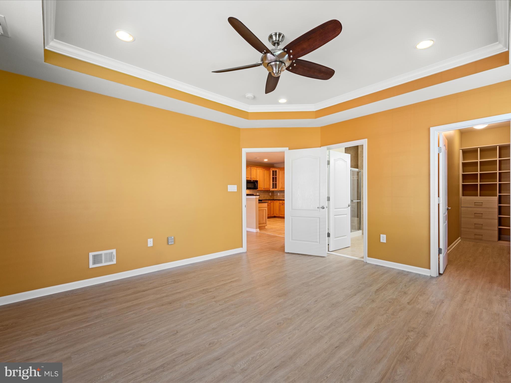 44322 Stableford Square Ashburn, VA 20147 - Photo 23 of 63 an empty room with wooden floor and a ceiling fan