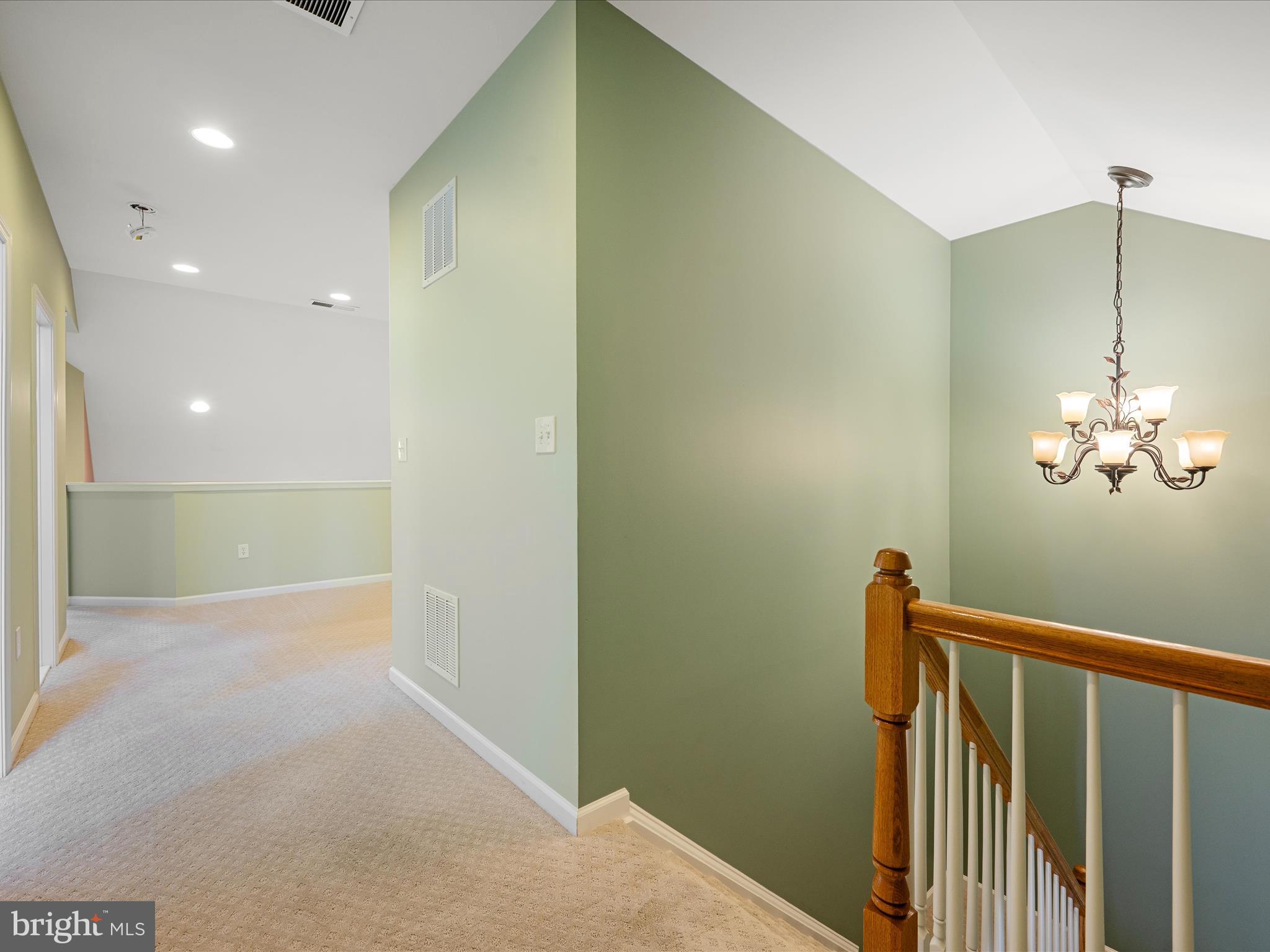 44322 Stableford Square Ashburn, VA 20147 - Photo 29 of 63 a view of a hallway with a chandelier