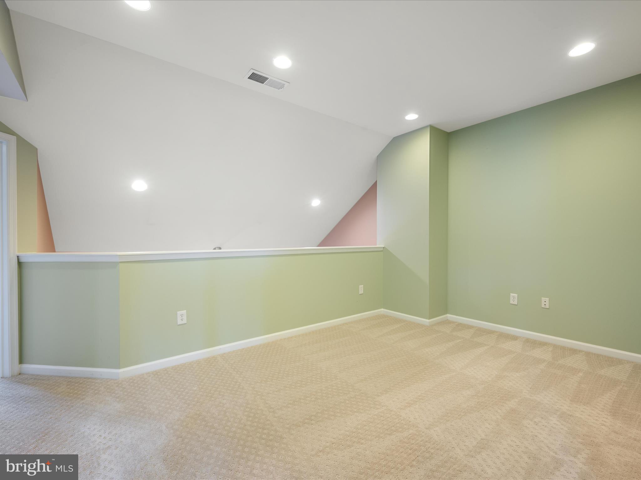 44322 Stableford Square Ashburn, VA 20147 - Photo 31 of 63 an empty room with a projector and entrance