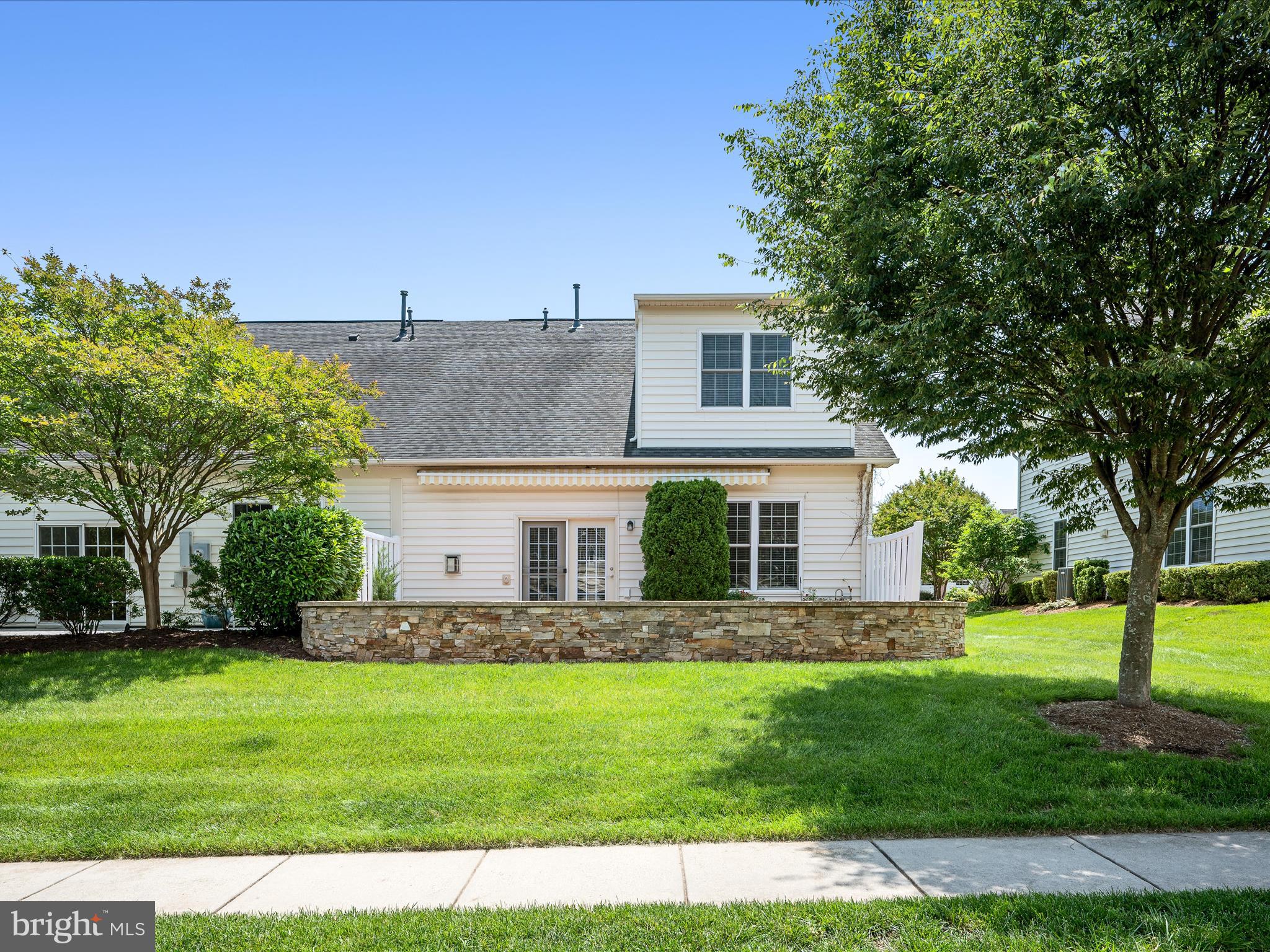 44322 Stableford Square Ashburn, VA 20147 - Photo 39 of 63 a front view of a house with a garden