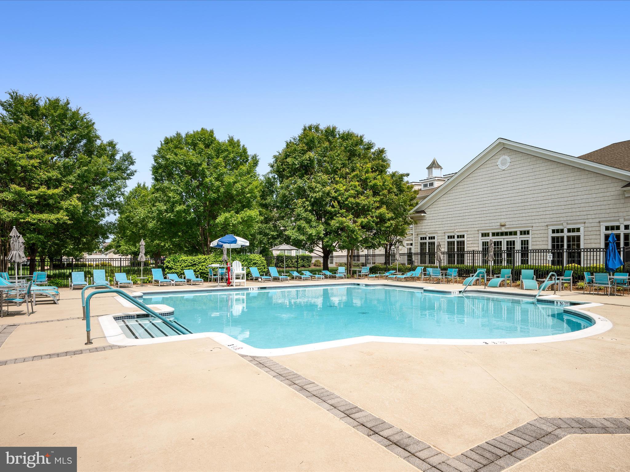 44322 Stableford Square Ashburn, VA 20147 - Photo 46 of 63 a view of a swimming pool and a yard
