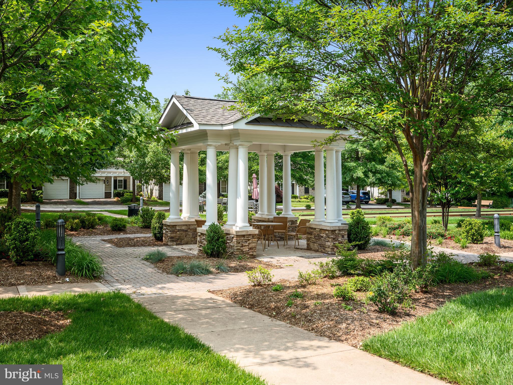 44322 Stableford Square Ashburn, VA 20147 - Photo 47 of 63 a front view of a house with a yard and trees