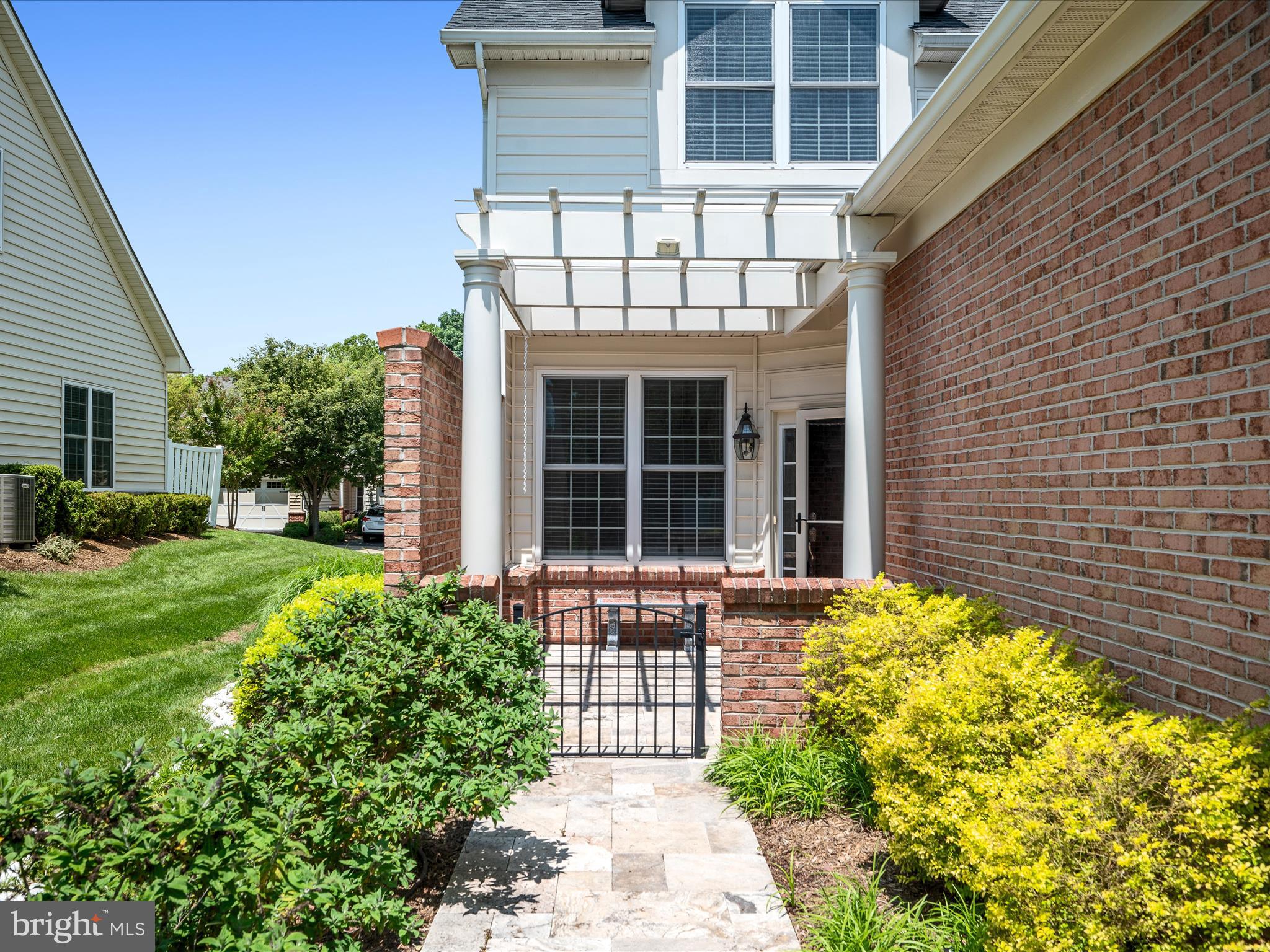 44322 Stableford Square Ashburn, VA 20147 - Photo 6 of 63 a front view of a house with garden