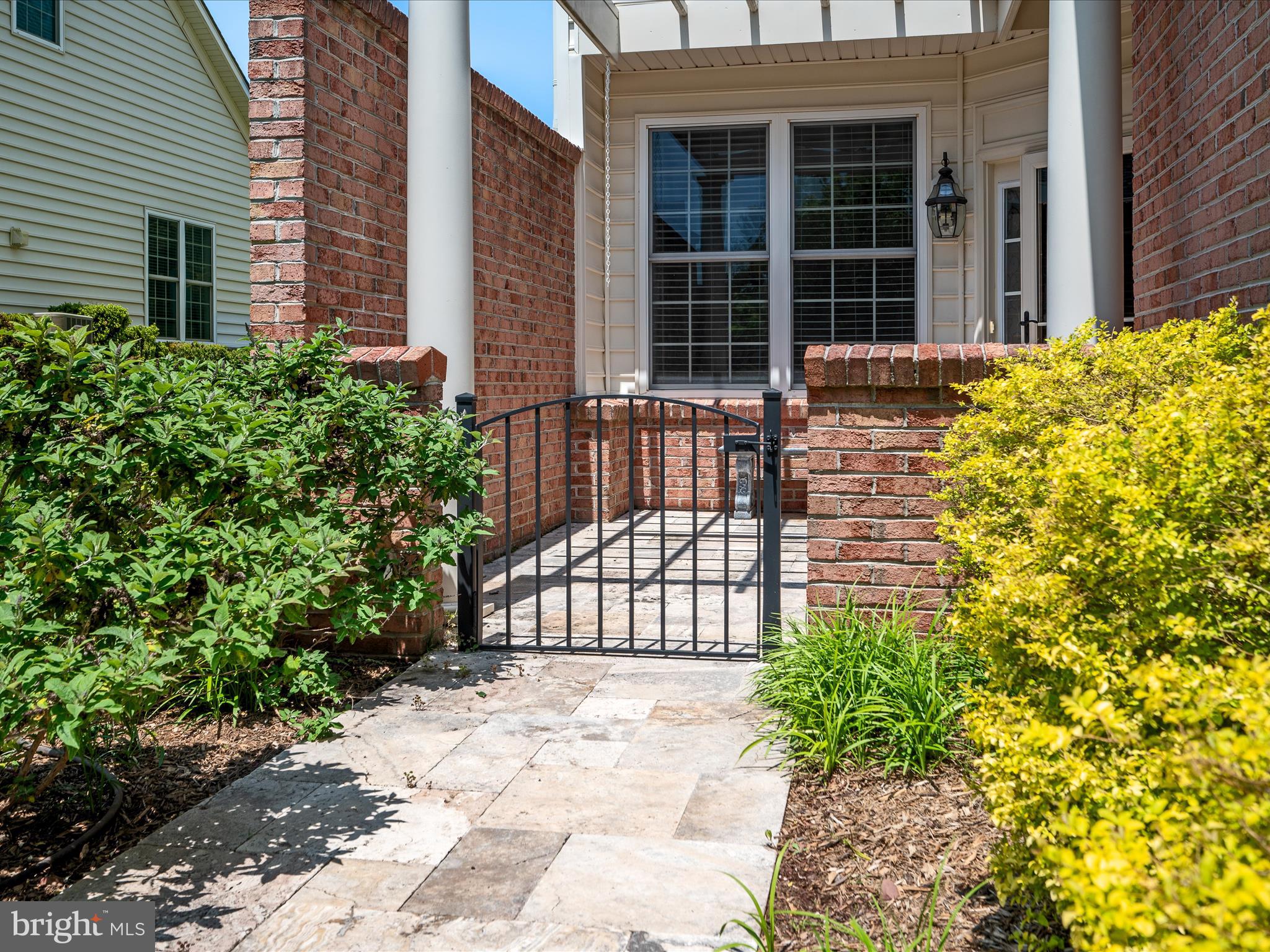 44322 Stableford Square Ashburn, VA 20147 - Photo 7 of 63 a view of a house with a large window and flower plants