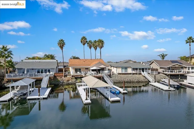 a view of a chairs and table in patio