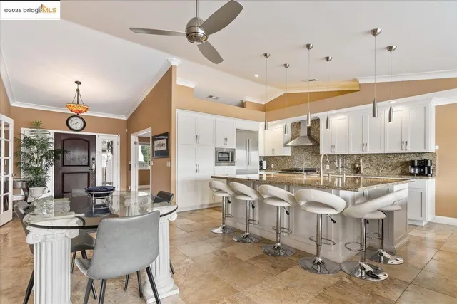 a kitchen with stainless steel appliances granite countertop a sink and cabinets