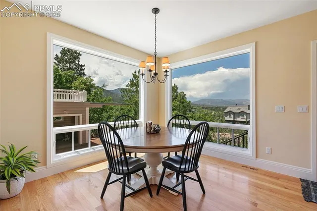 a view of a patio with a table chairs and backyard