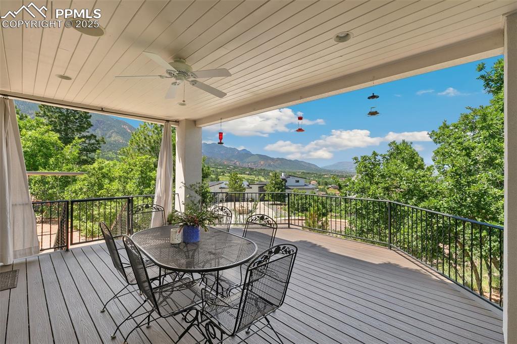 4490 Star Ranch Road Colorado Springs, CO 80906 - Photo 17 of 50 a view of a patio with a table chairs and backyard