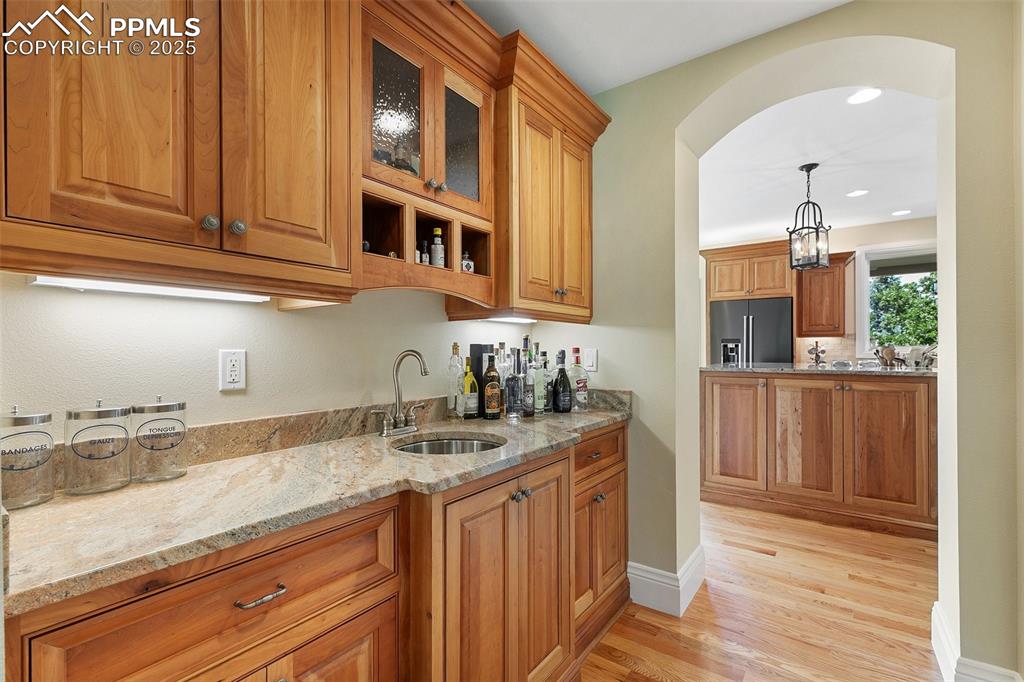 4490 Star Ranch Road Colorado Springs, CO 80906 - Photo 18 of 50 a kitchen with stainless steel appliances granite countertop a sink and cabinets