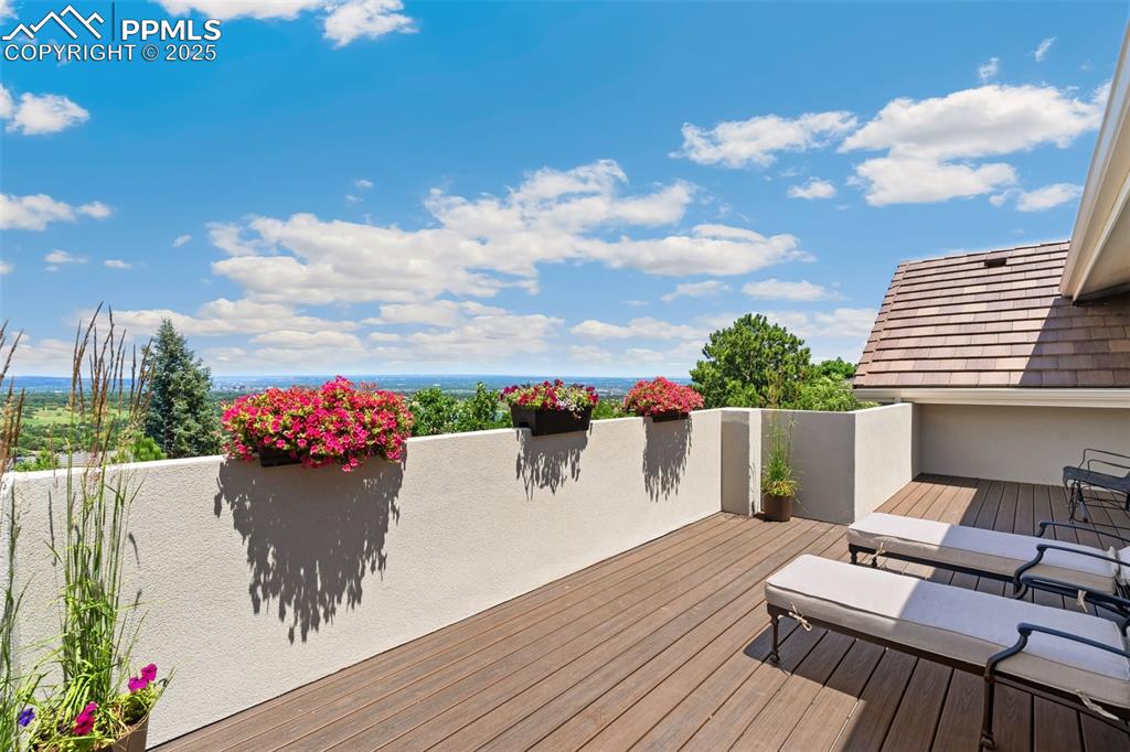 4490 Star Ranch Road Colorado Springs, CO 80906 - Photo 25 of 50 a view of a tables and chairs on the roof deck