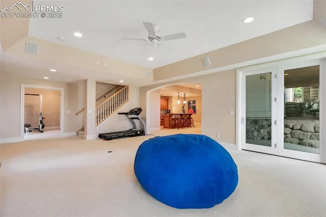 a living room with furniture and kitchen view