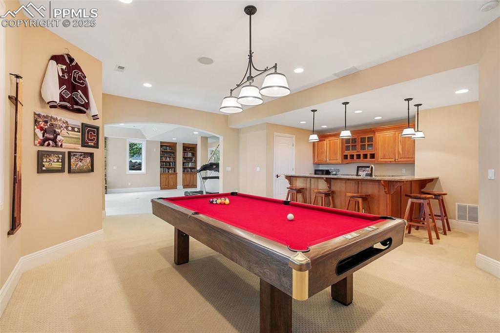 4490 Star Ranch Road Colorado Springs, CO 80906 - Photo 39 of 50 a room with pool table and windows