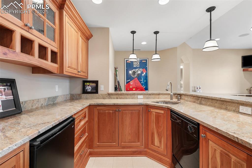 4490 Star Ranch Road Colorado Springs, CO 80906 - Photo 40 of 50 a kitchen with a sink dishwasher and cabinets