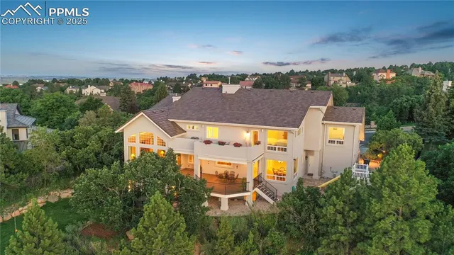 an aerial view of residential houses and outdoor space