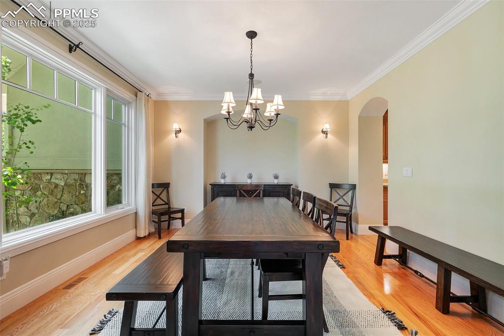 4490 Star Ranch Road Colorado Springs, CO 80906 - Photo 7 of 50 a view of a dining room with furniture window and wooden floor