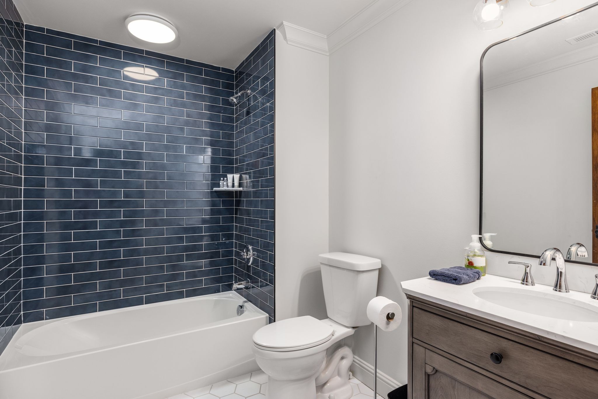 653 Flippen Road Lebanon, TN 37087 - Photo 33 of 71 a bathroom with a granite countertop toilet a sink and bathtub