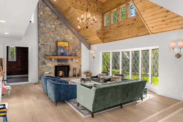a kitchen with cabinets and chairs
