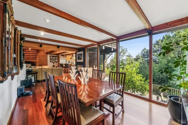 a view of a dining room with furniture window and outside view
