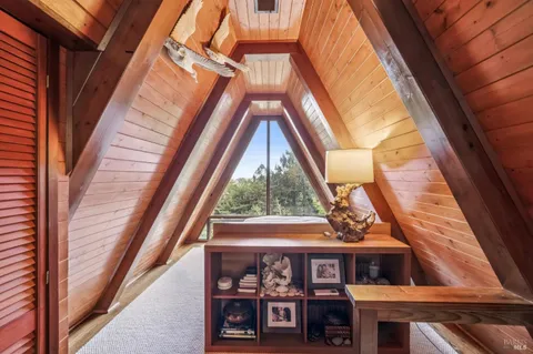 a view of a brick house with a large window
