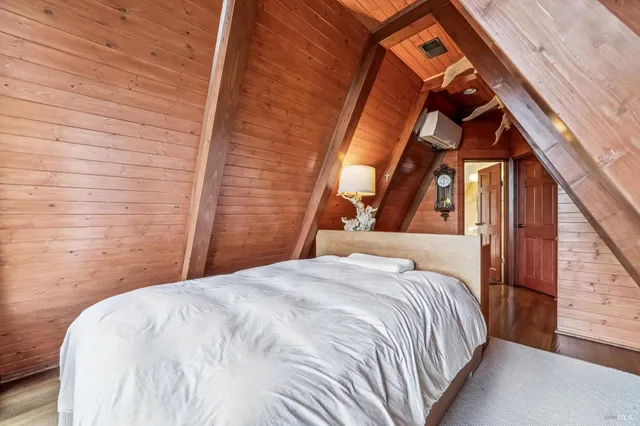 a bedroom with a bed and balcony