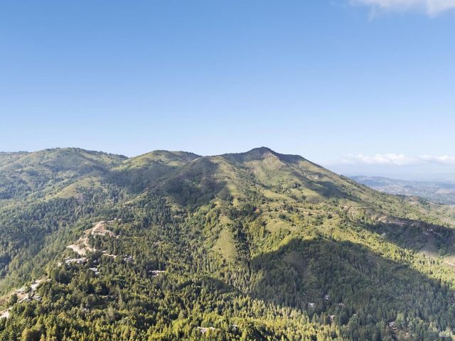 a view of mountains and valleys