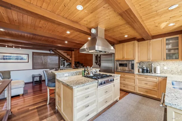 a kitchen with a stove a sink and a refrigerator